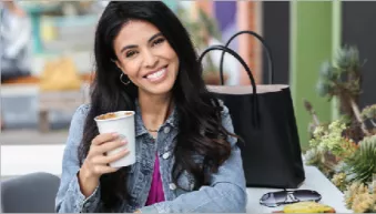 A Female Spark Retainer patient enjoying a cup of coffee