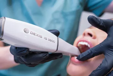 Dexis scanner handheld scanning patient's teeth